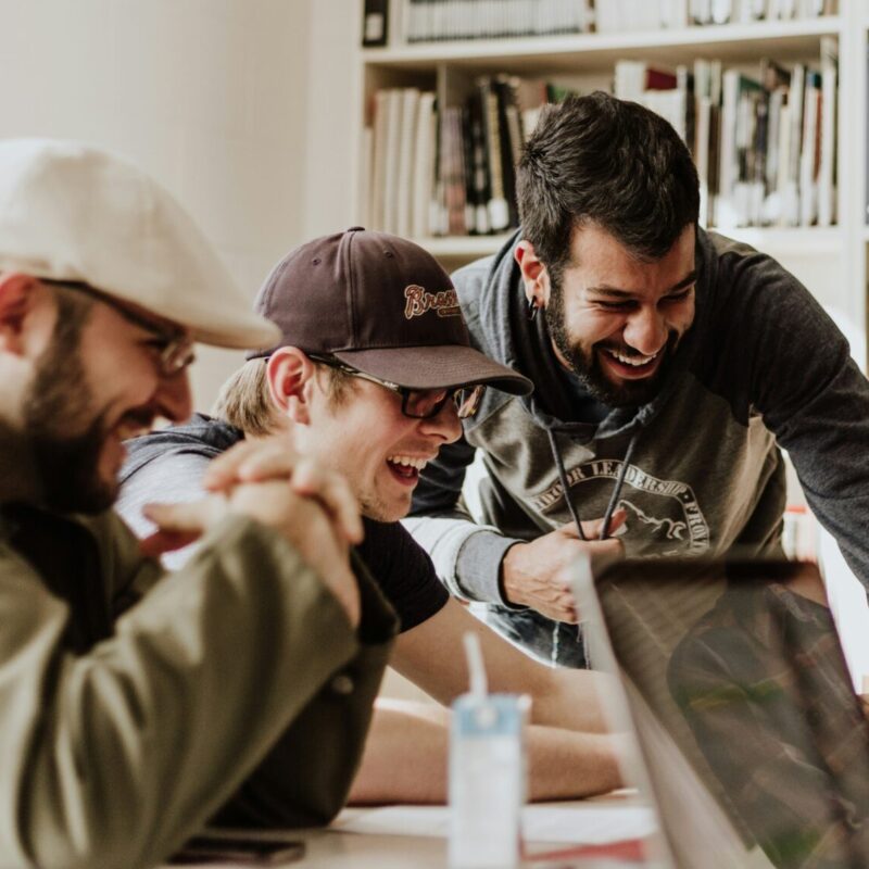 Professional team collaborating, demonstrating emotional intelligence in workplace communication, showing diverse colleagues engaging in supportive, empathetic interaction